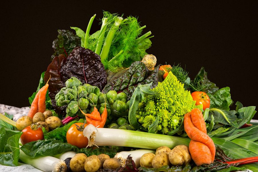 A box of fresh vegetables from a community supported agriculture farm share